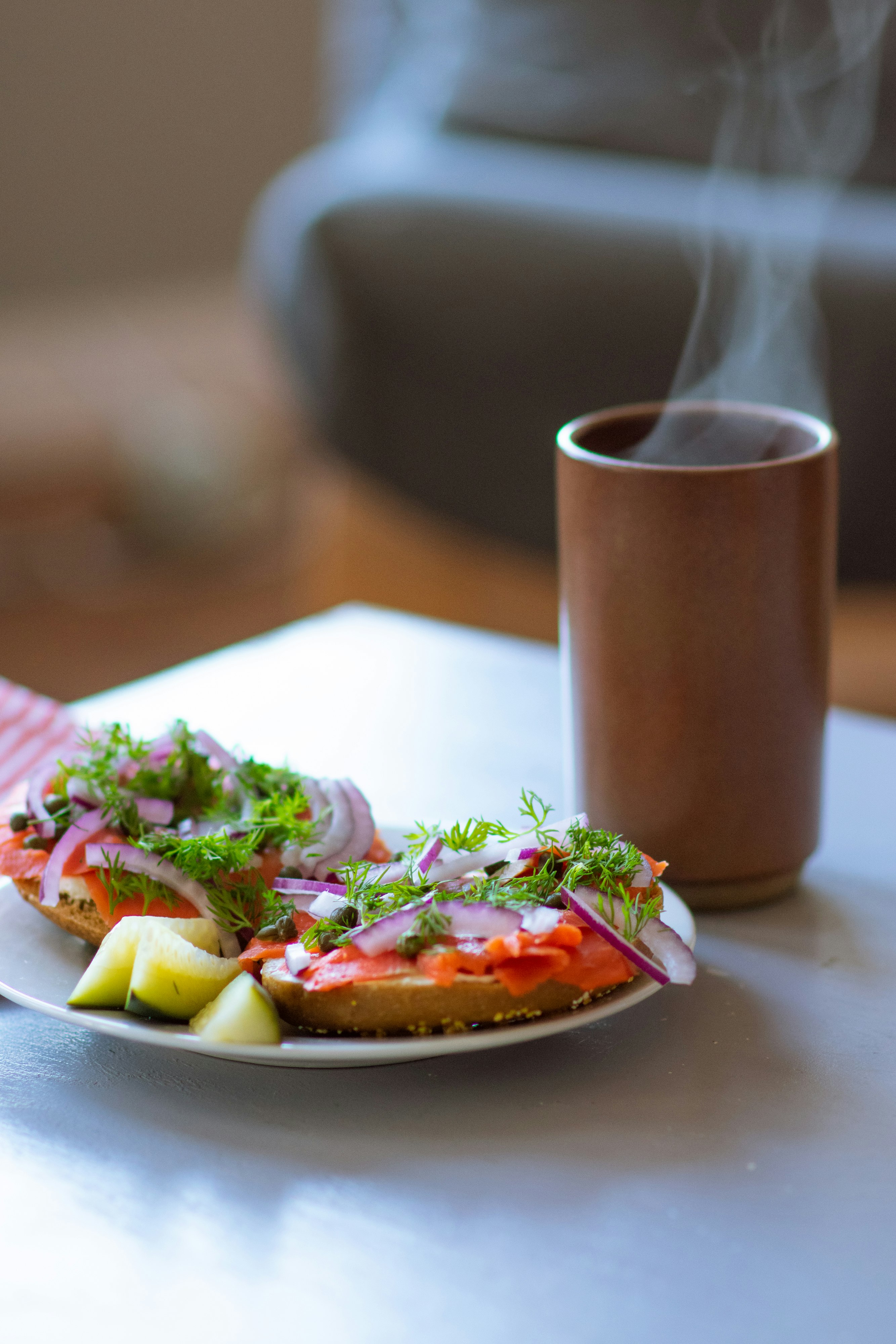 sliced tomato and green vegetable on brown ceramic plate